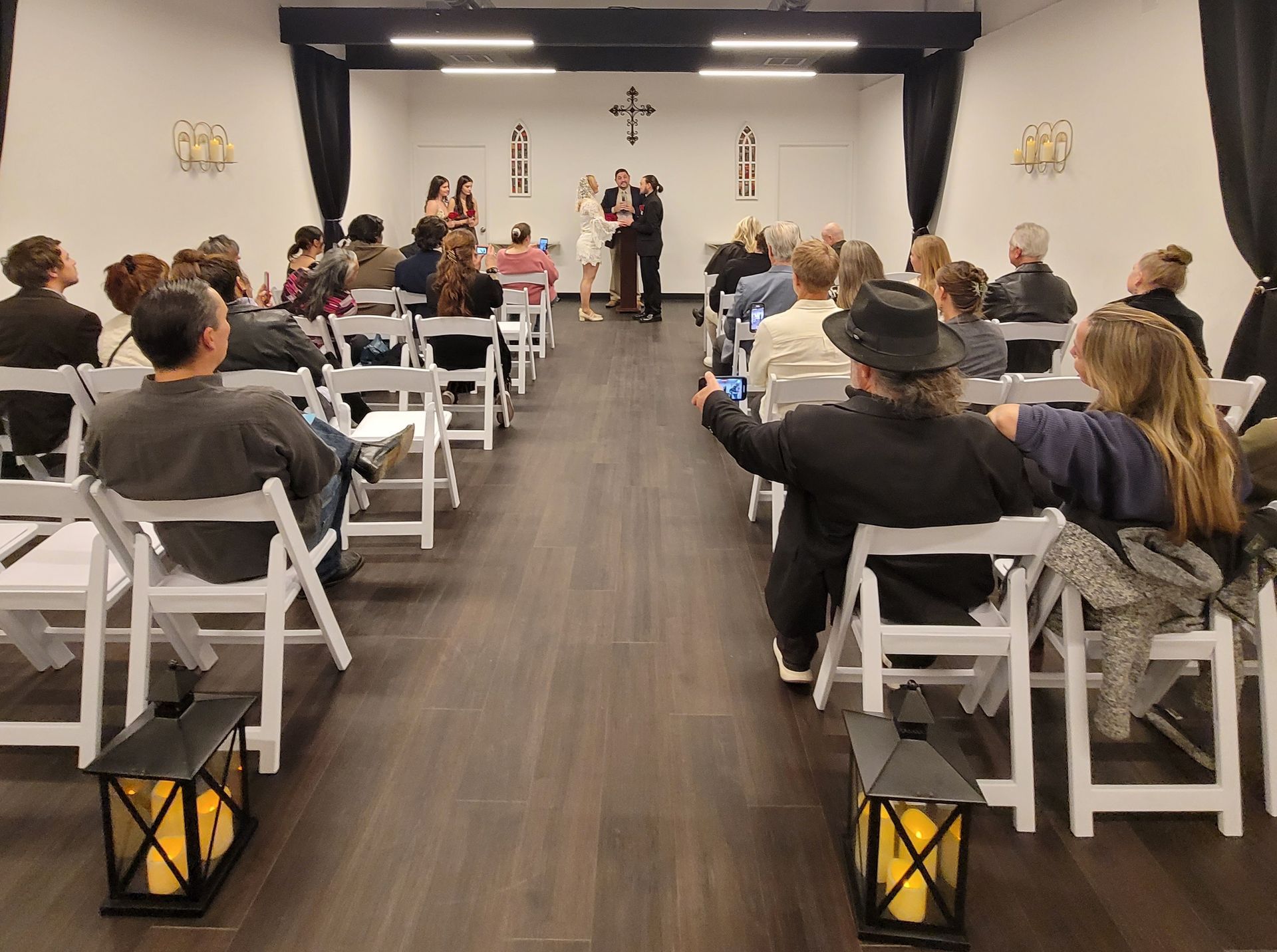 Couple's wedding ceremony with a guests at the Today We Become One Wedding and Event Chapel in Palm Desert, CA