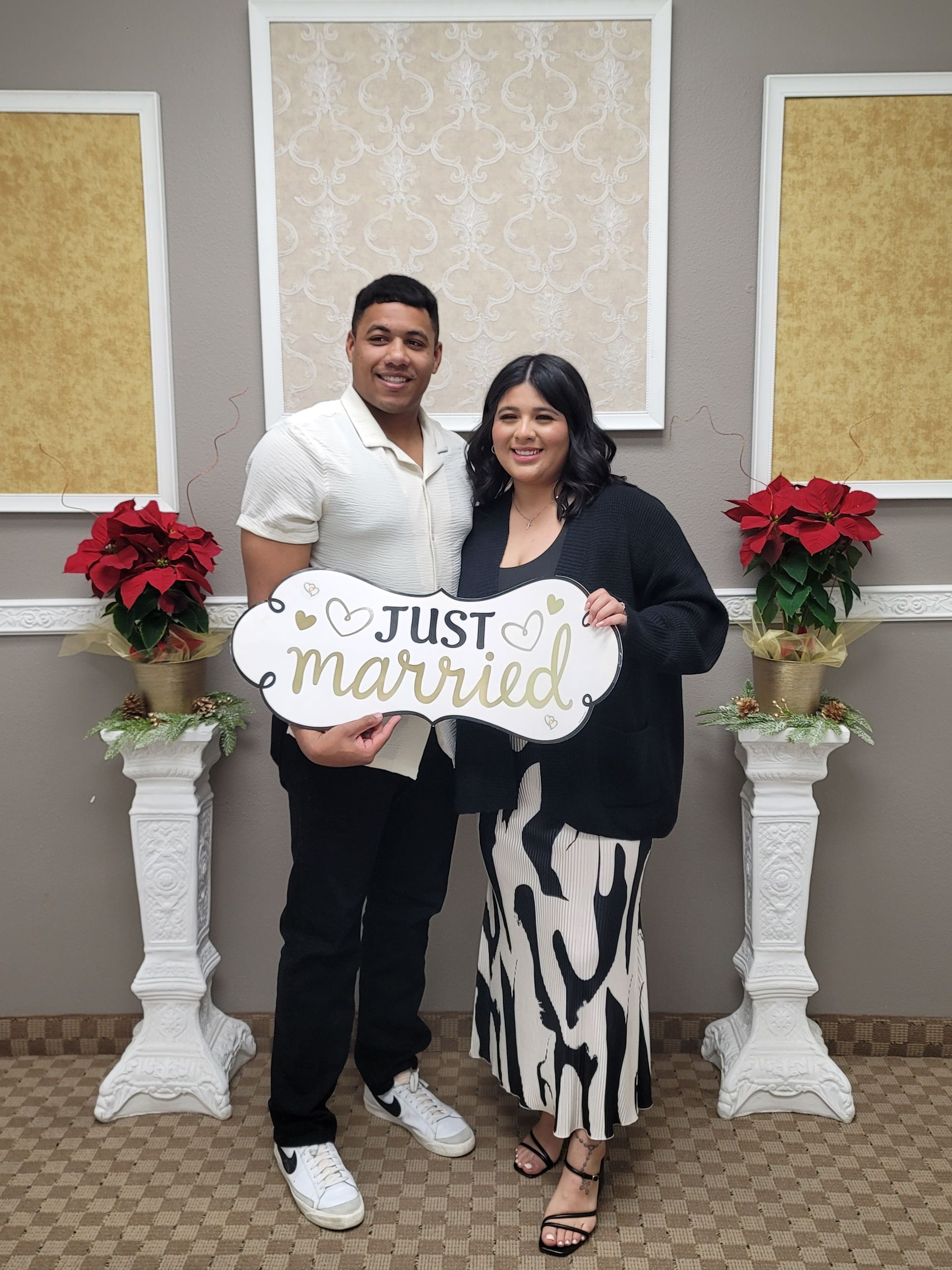 Newly married couple holding a