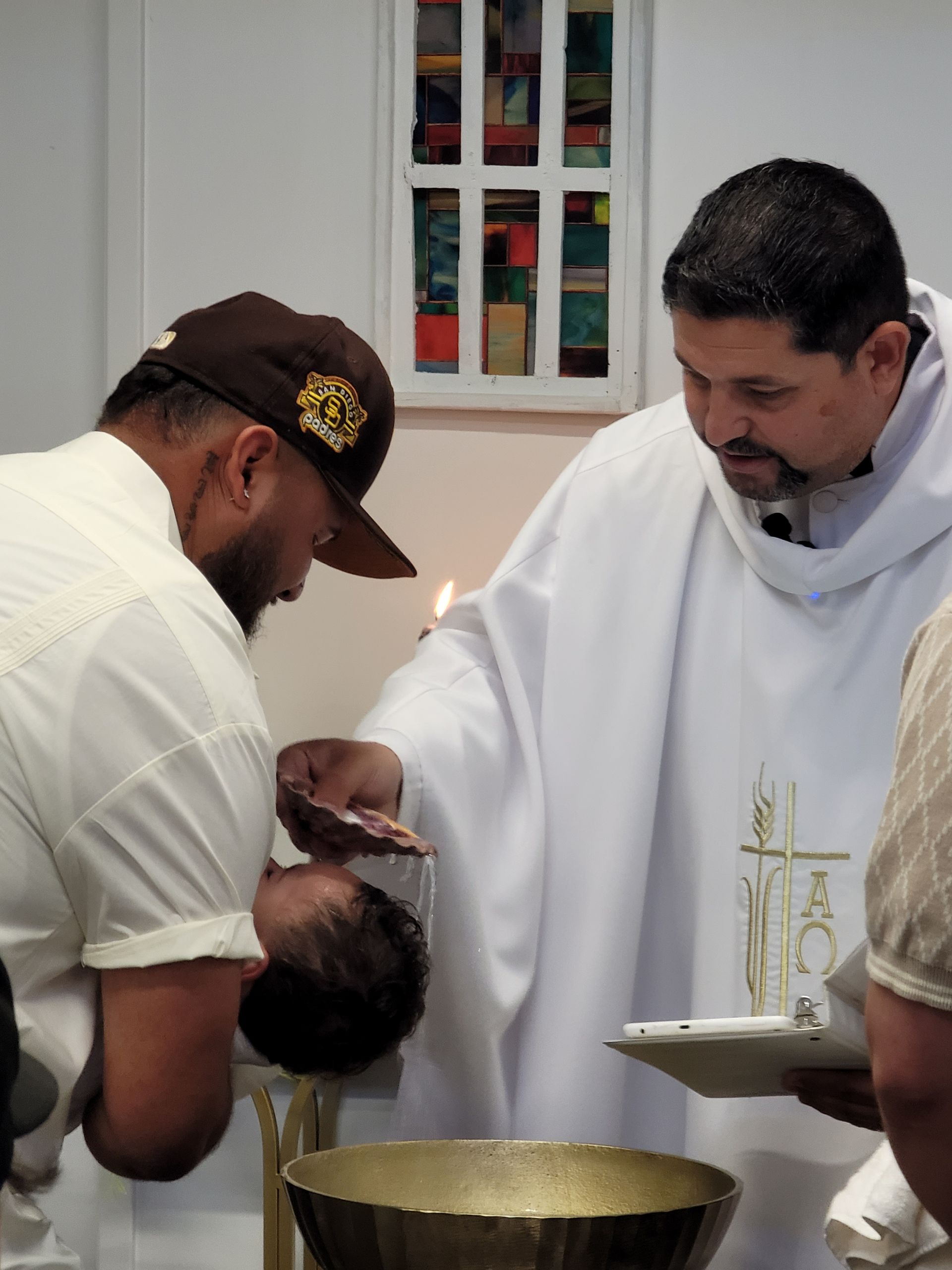 Rev. Steve performs a Baptismal Ceremony at the Today We Become One Wedding and Event Chapel.