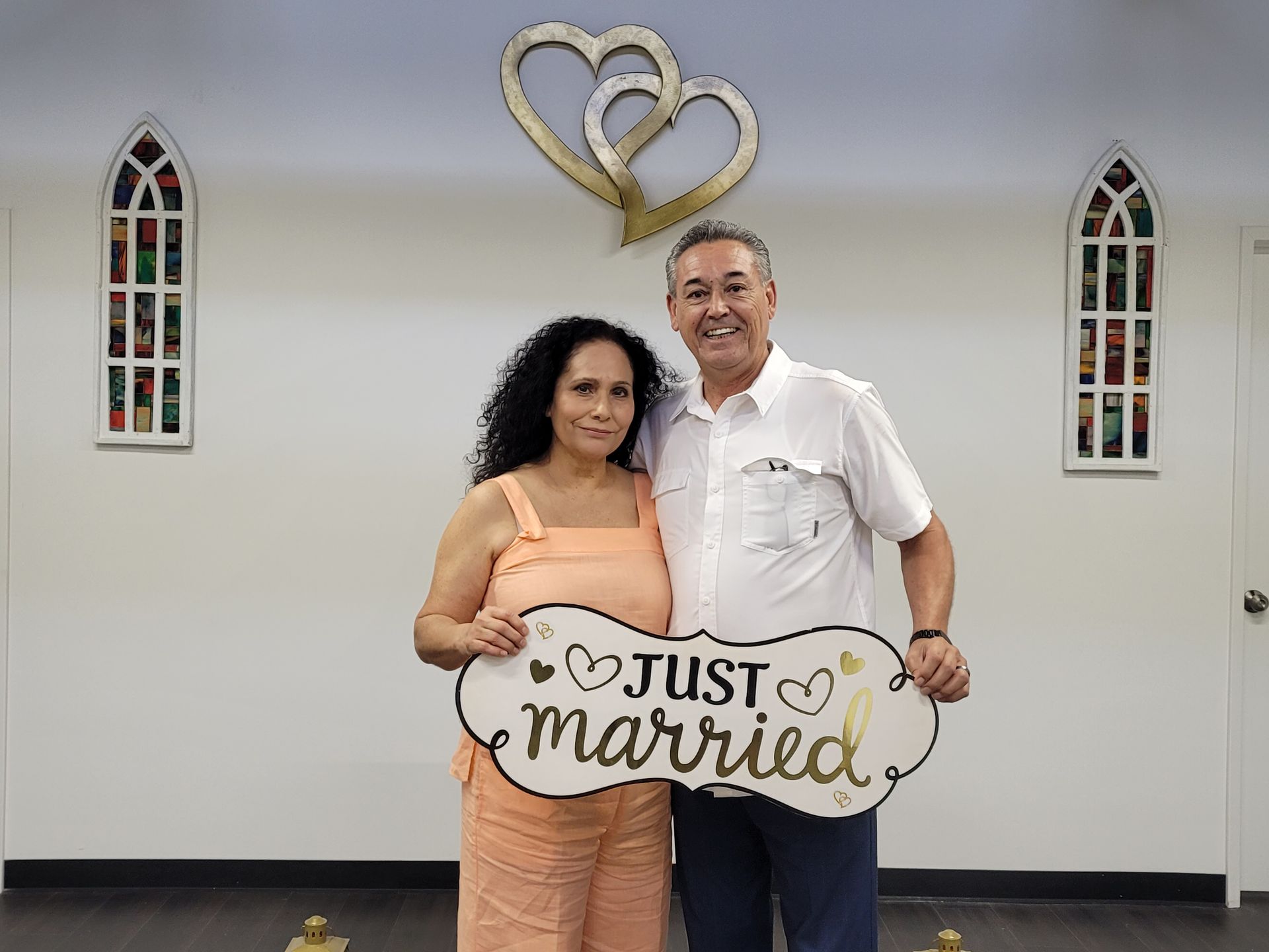 Newly married couple holding a