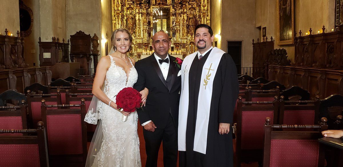 Rev. Steve poses with a newly married couple at the St. Francis Chapel at the Mission Inn in Riverside, CA