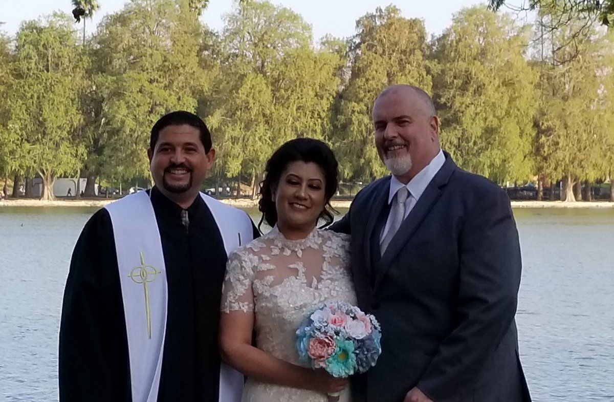 Riverside Vow Renewal Ceremony after ceremony photo with the couple and Rev. Steve
