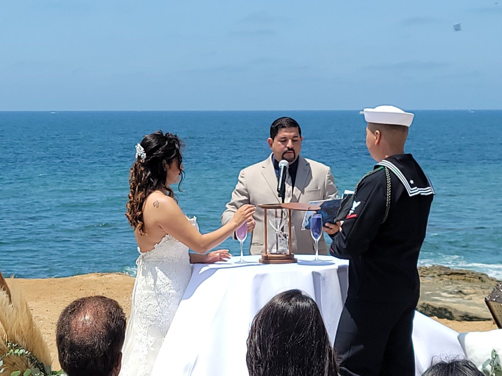 Blending of Sands Unity Ceremony by a Navy Groom and His Bride during a Beach Ceremony presided over by Rev. Steve
