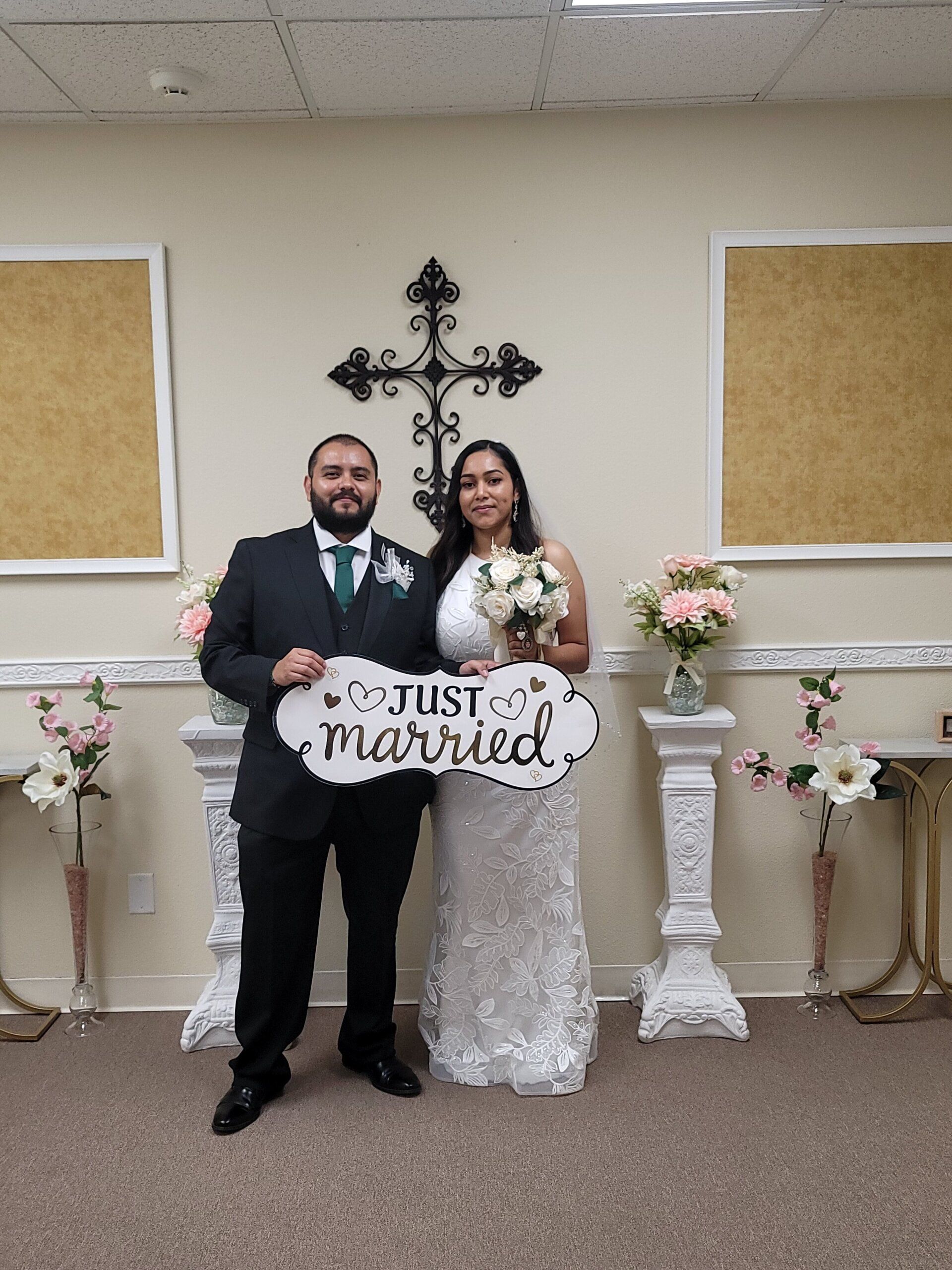 Pink and blush floral accents adorn the Elopement Chapel this couple just had their ceremony in