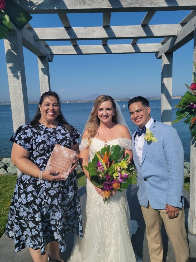 Rev. Jennifer celebrates with her newly married couple after a San Diego Destination Wedding