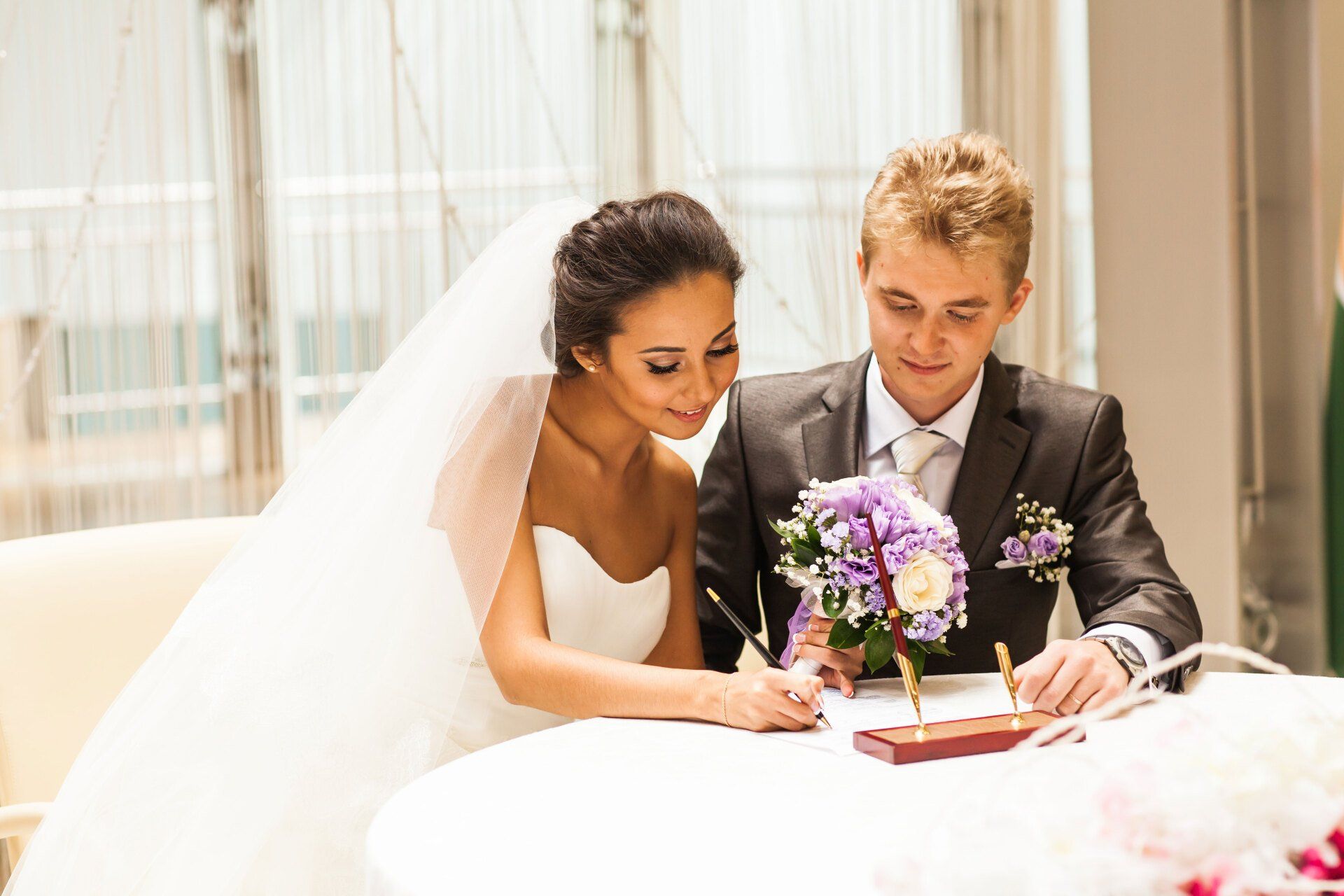 Couple signing a marriage contract