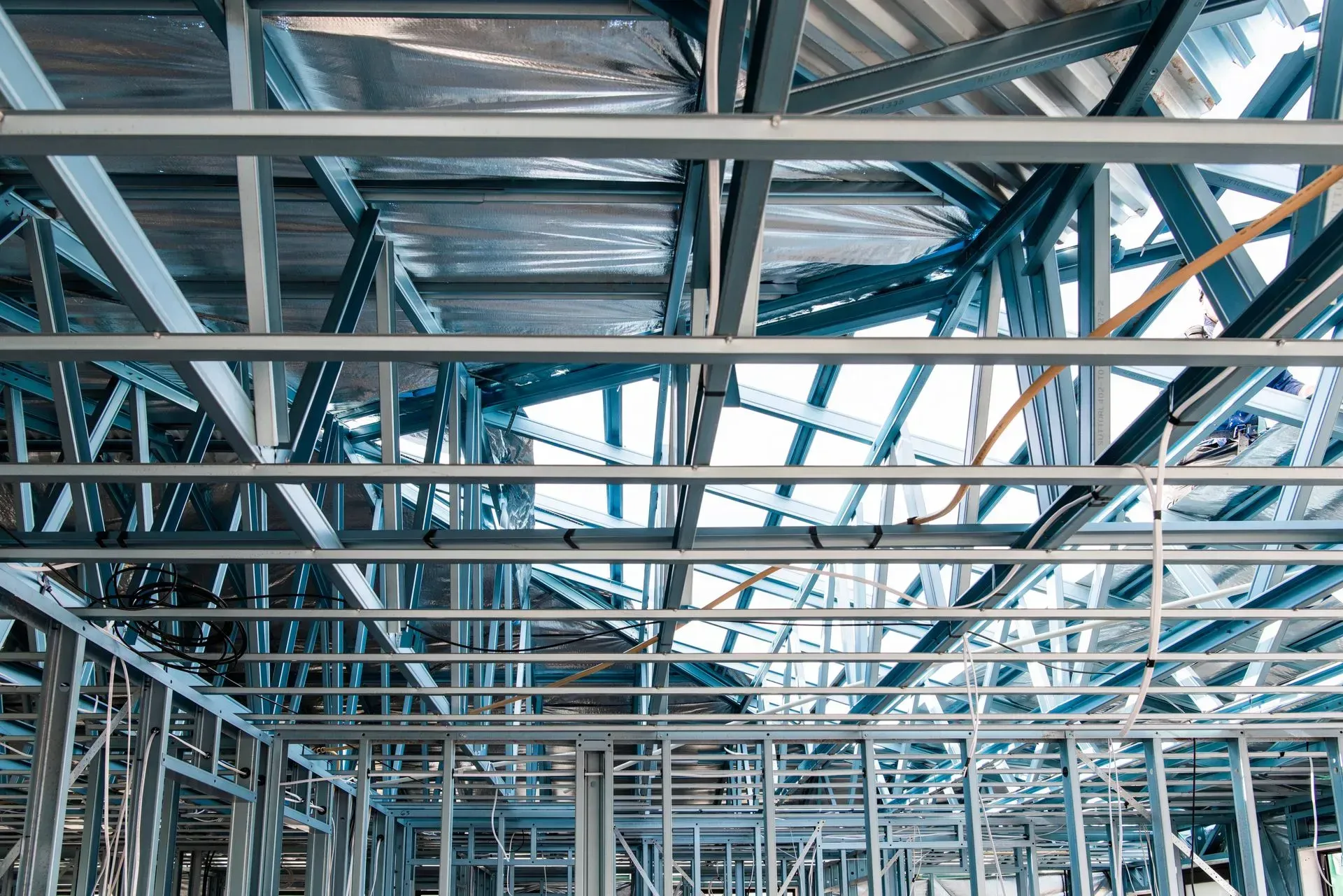 The Inside of a Building Under Construction With Metal Beams — Steel Frame Company In Mudgee, NSW