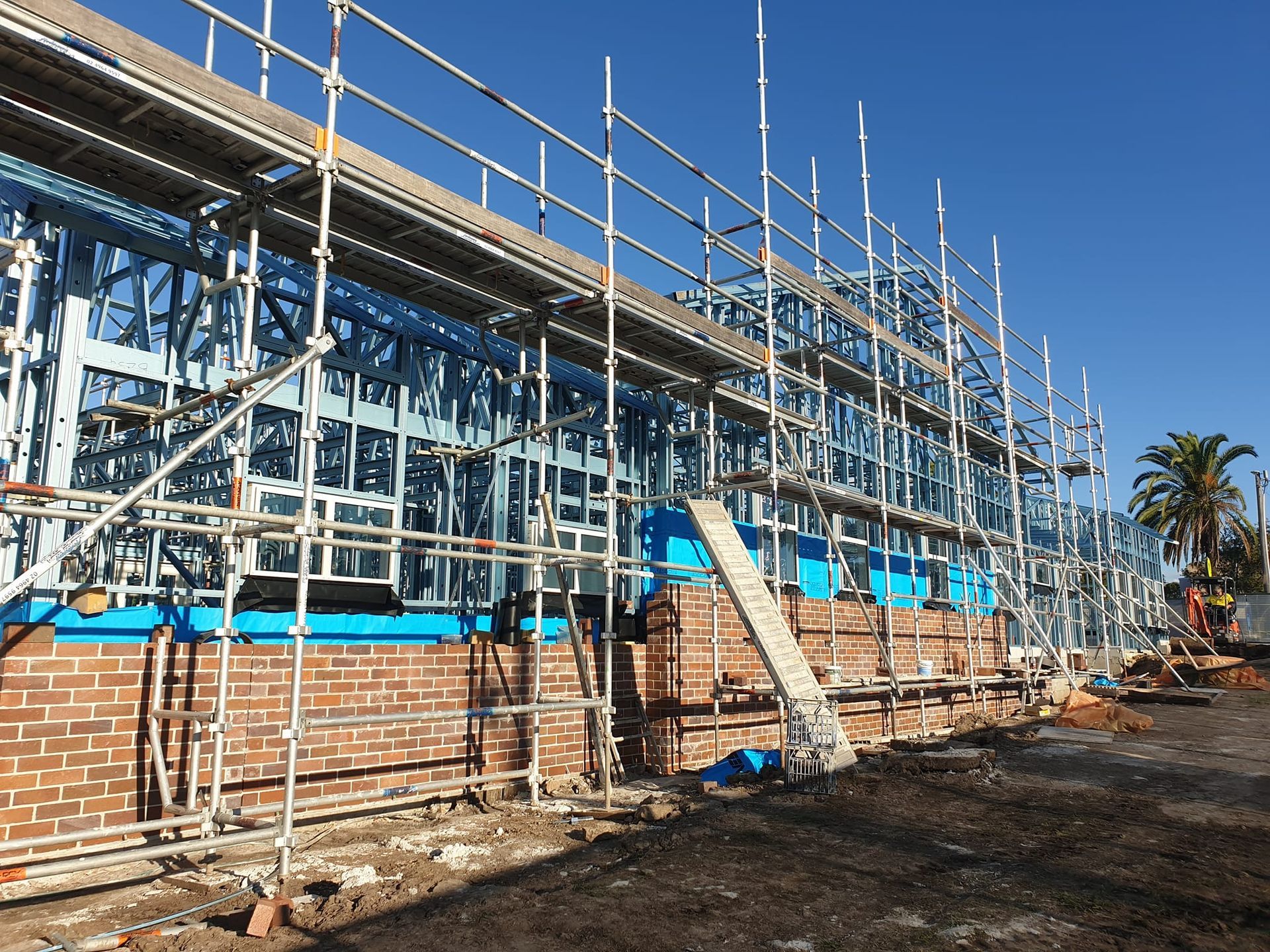 A large building is being built with scaffolding around it