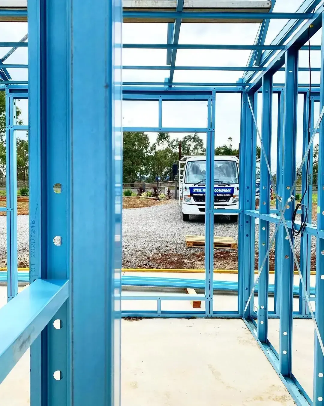 A Building Under Construction With a Truck Parked in the Background — Steel Frame Company In Mudgee, NSW 