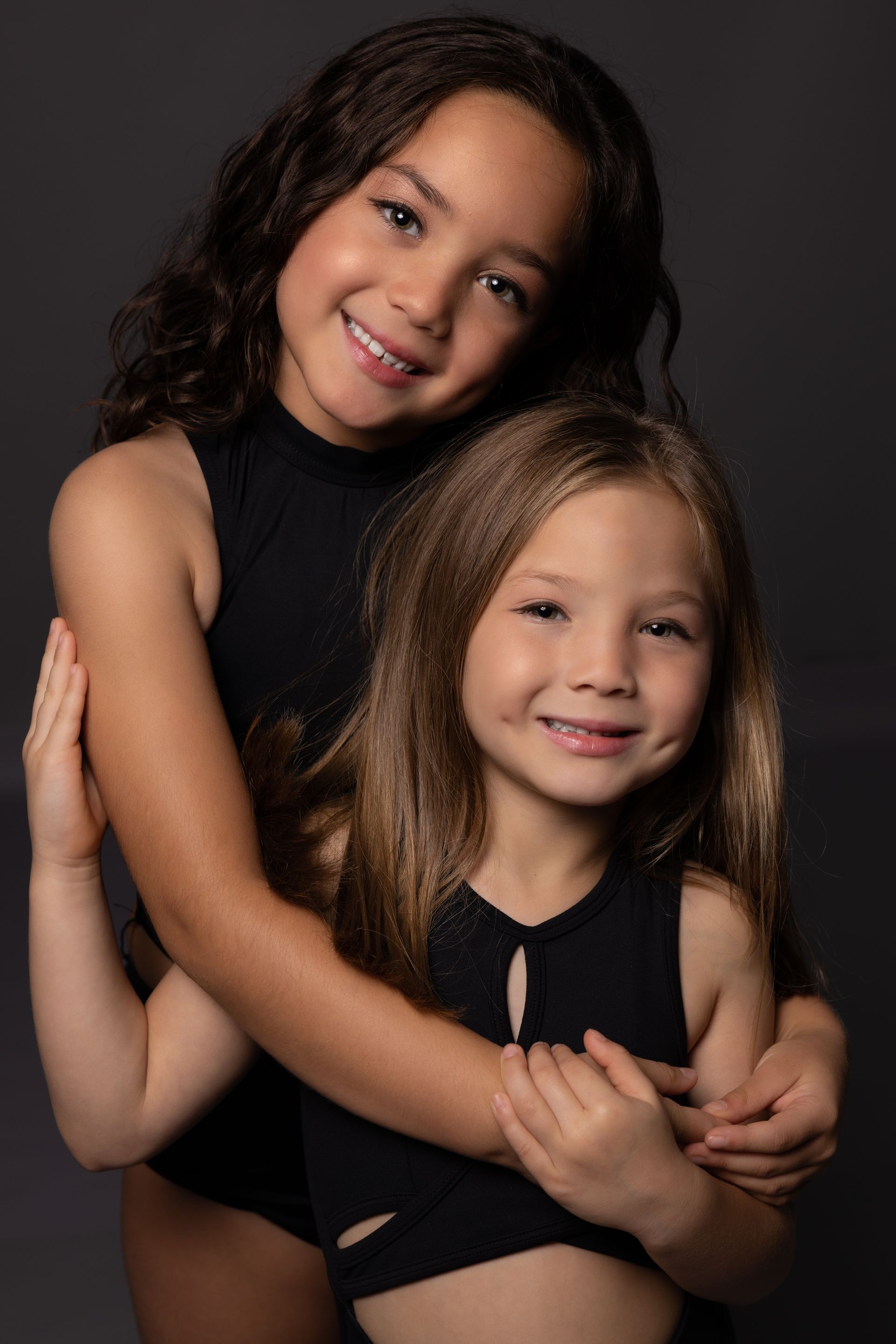 two girls smiling | Visit a general dentist in Four Corners, FL.