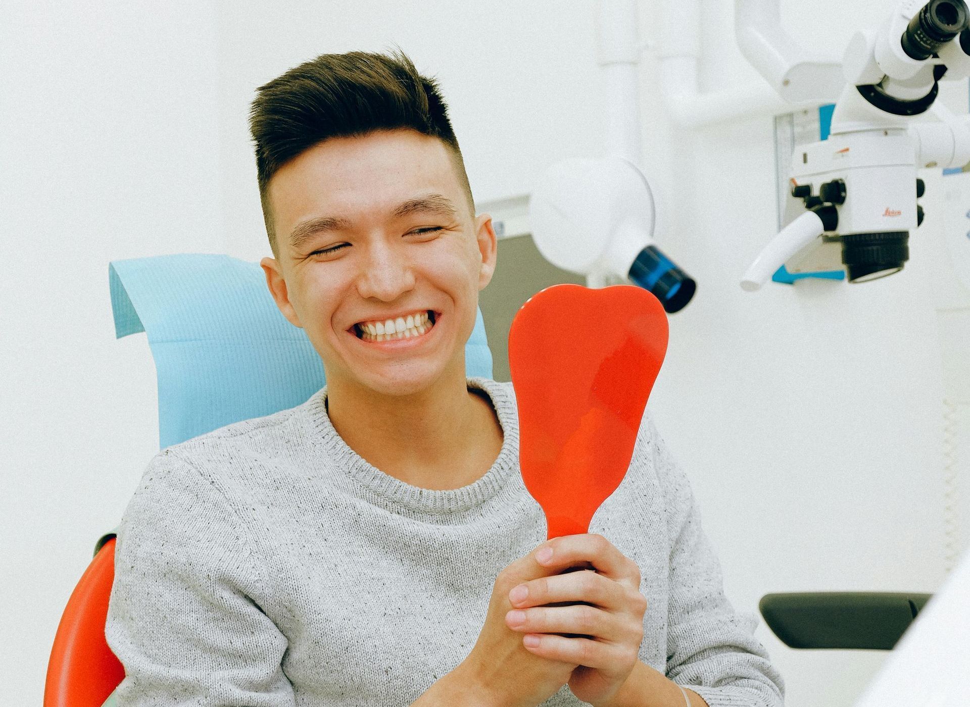 Man smiling during a dental check-up | Visit a dentist in Davenport, FL.
