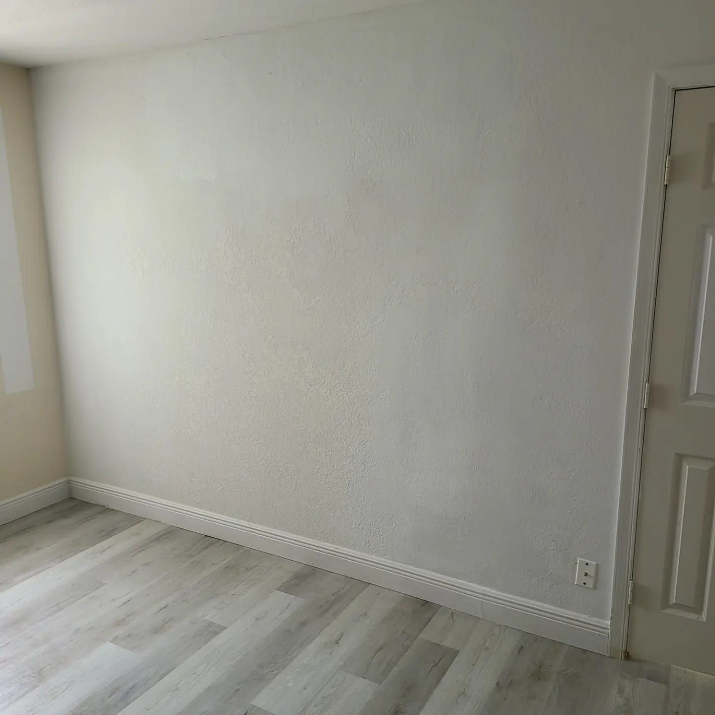 A kitchen with a cutting board and a spray bottle