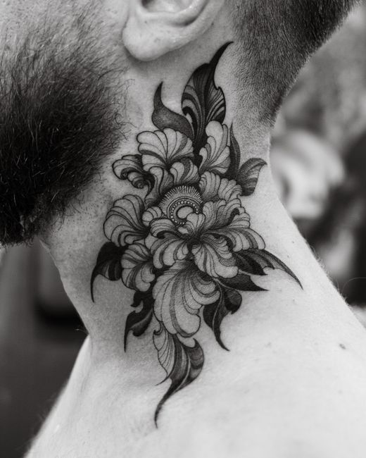 Delicate fine line tattoo with intricate detail and precisely executed thin linework