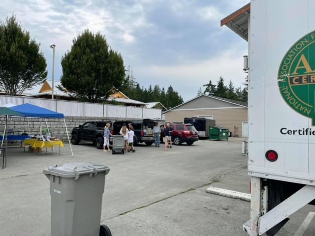A certified truck is parked in a parking lot