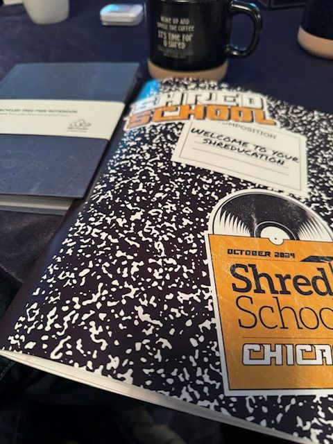A book titled shred school chicago sits on a table