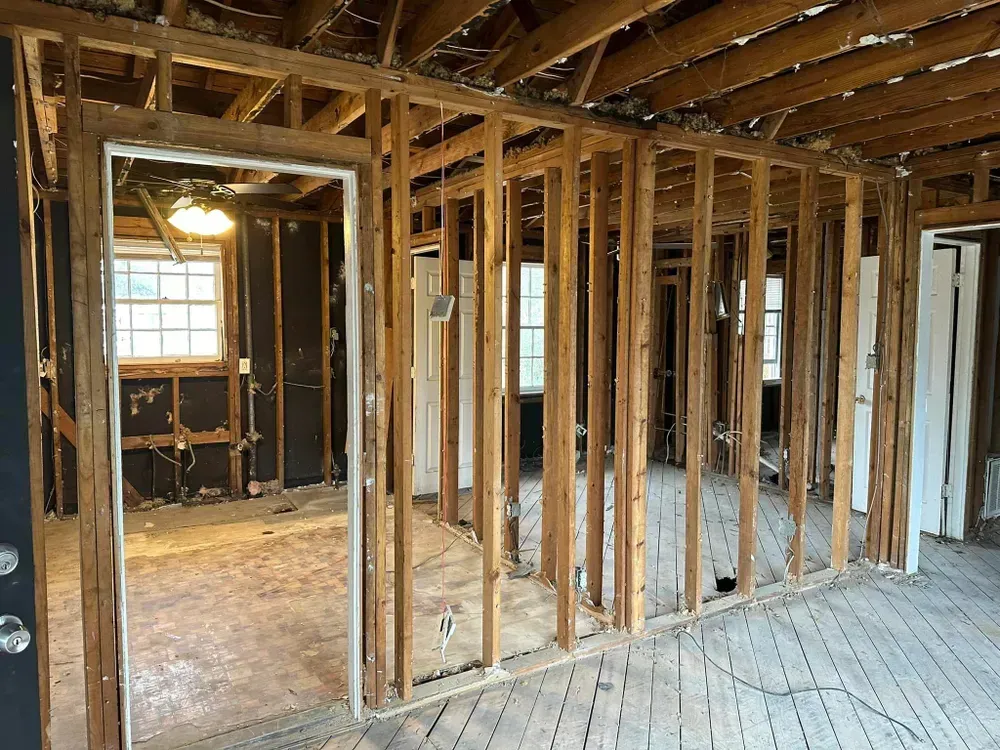 A house is being remodeled and the walls are being removed.