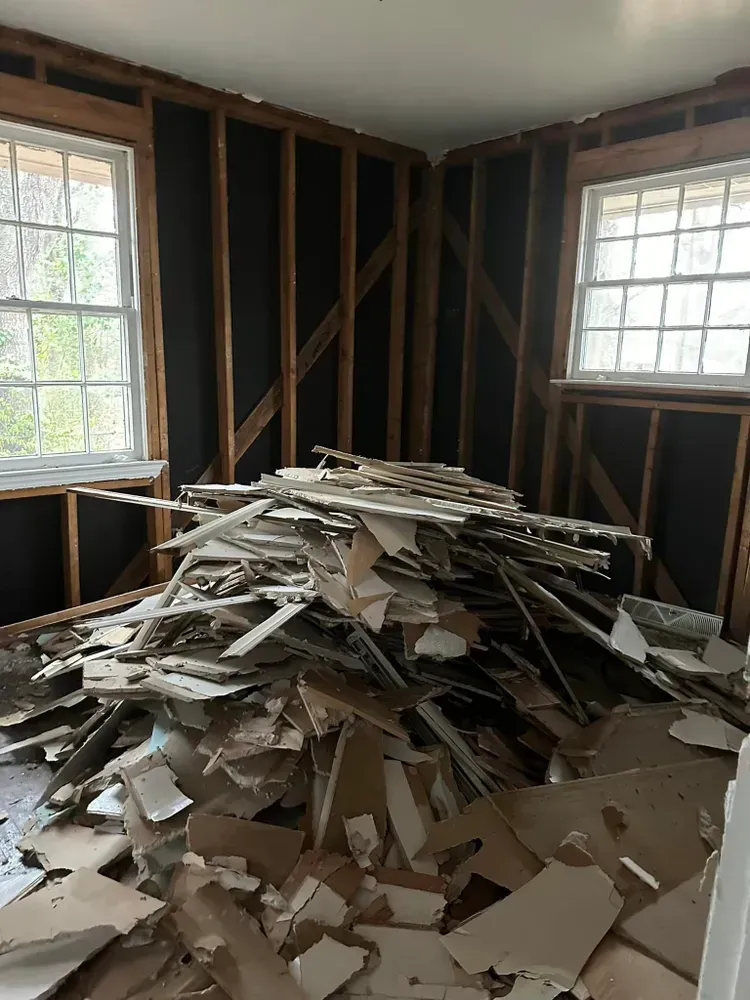 There is a pile of cardboard in the middle of the room.