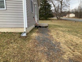 Side View of House Before Driveway Construction — Pine Bush, NY — Creative Touch Landscaping & Home Improvement Inc.
