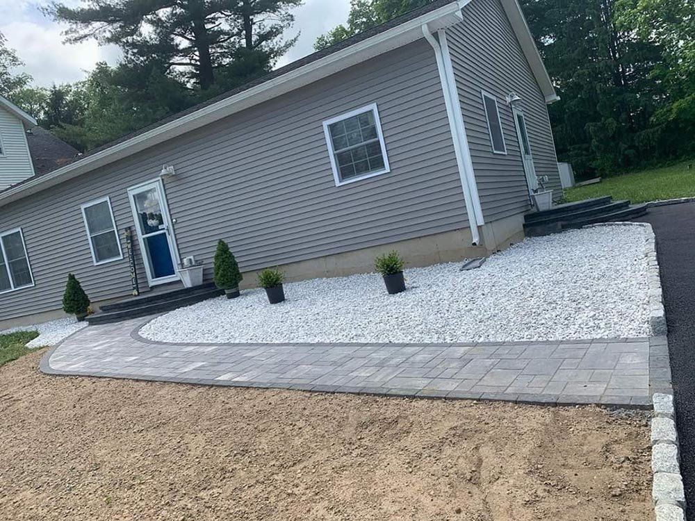 Gray House with New Patio — Pine Bush, NY — Creative Touch Landscaping & Home Improvement Inc.