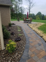Retaining Wall with Flowers — Pine Bush, NY — Creative Touch Landscaping & Home Improvement Inc.