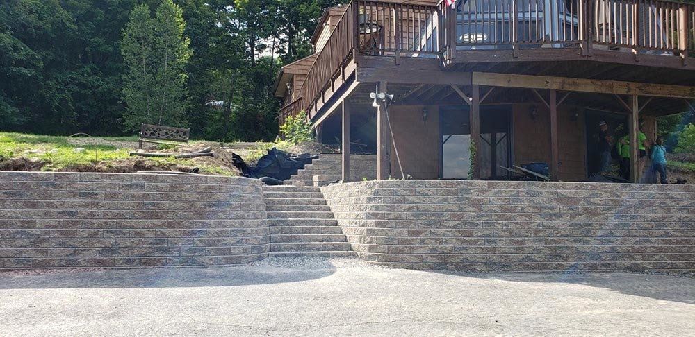 Multi Tiered Retaining Wall with Stair — Pine Bush, NY — Creative Touch Landscaping & Home Improvement Inc.