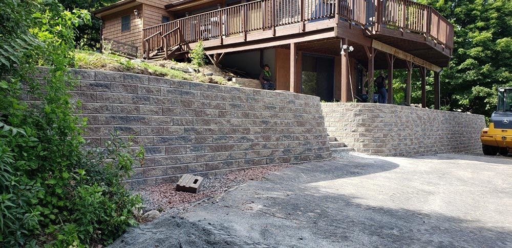 Big House with Retaining Wall — Pine Bush, NY — Creative Touch Landscaping & Home Improvement Inc.