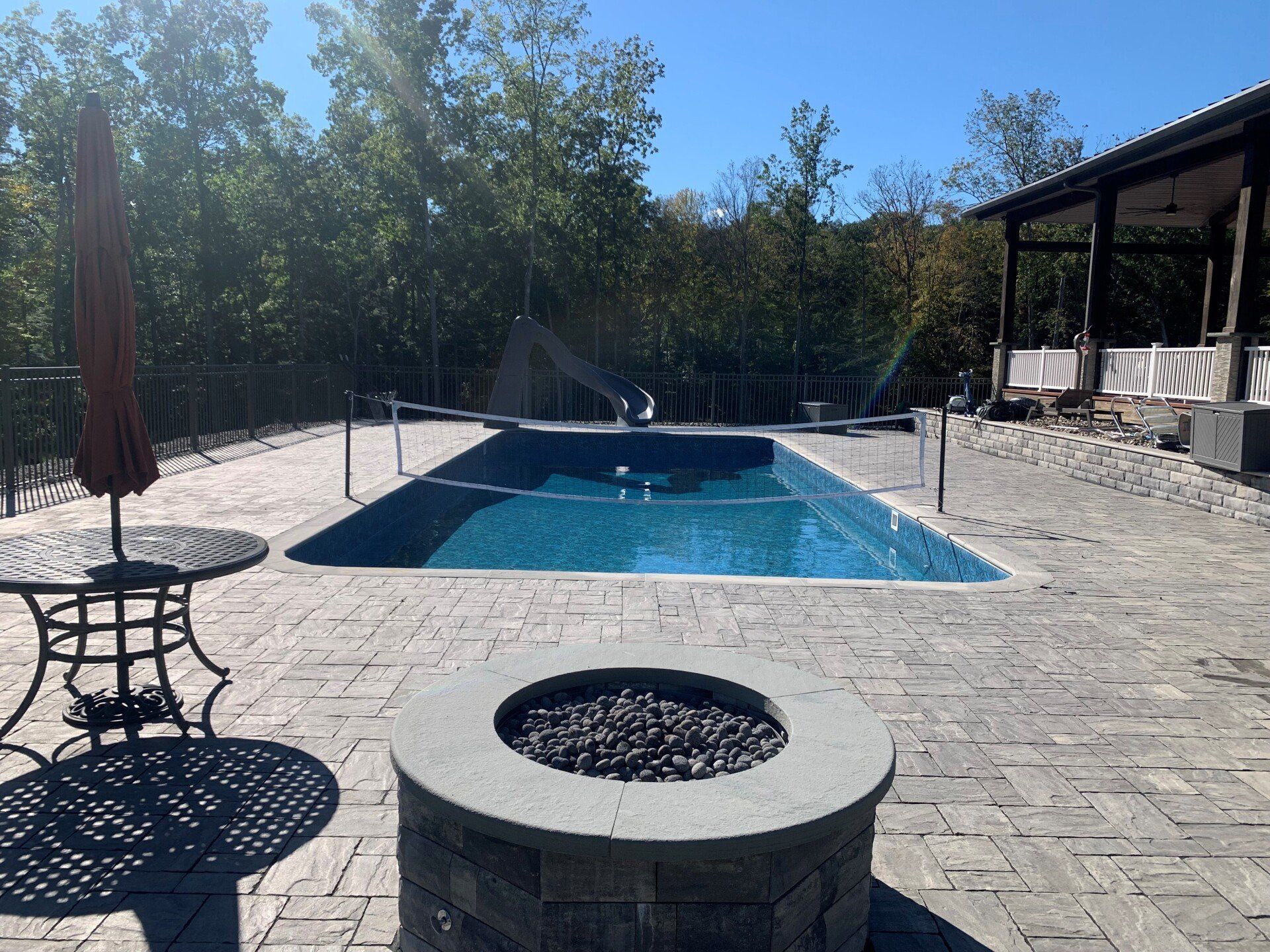 Fire Pit beside Pool — Walden, NY — Creative Touch Landscaping & Supply