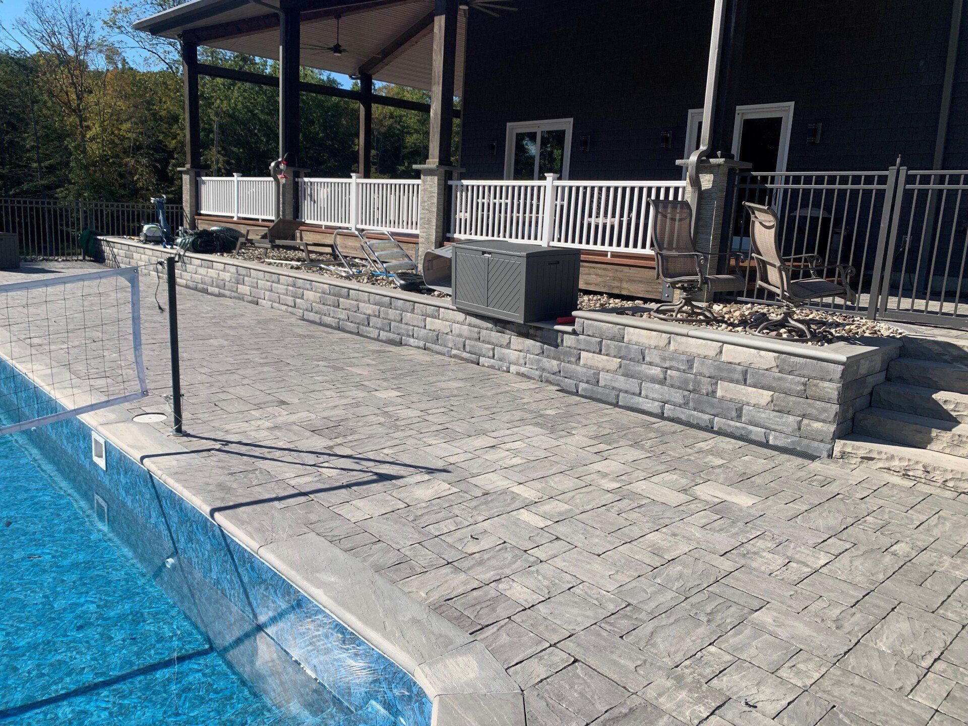 UNILOCK Ucara Wall beside Pool — Walden, NY — Creative Touch Landscaping & Supply