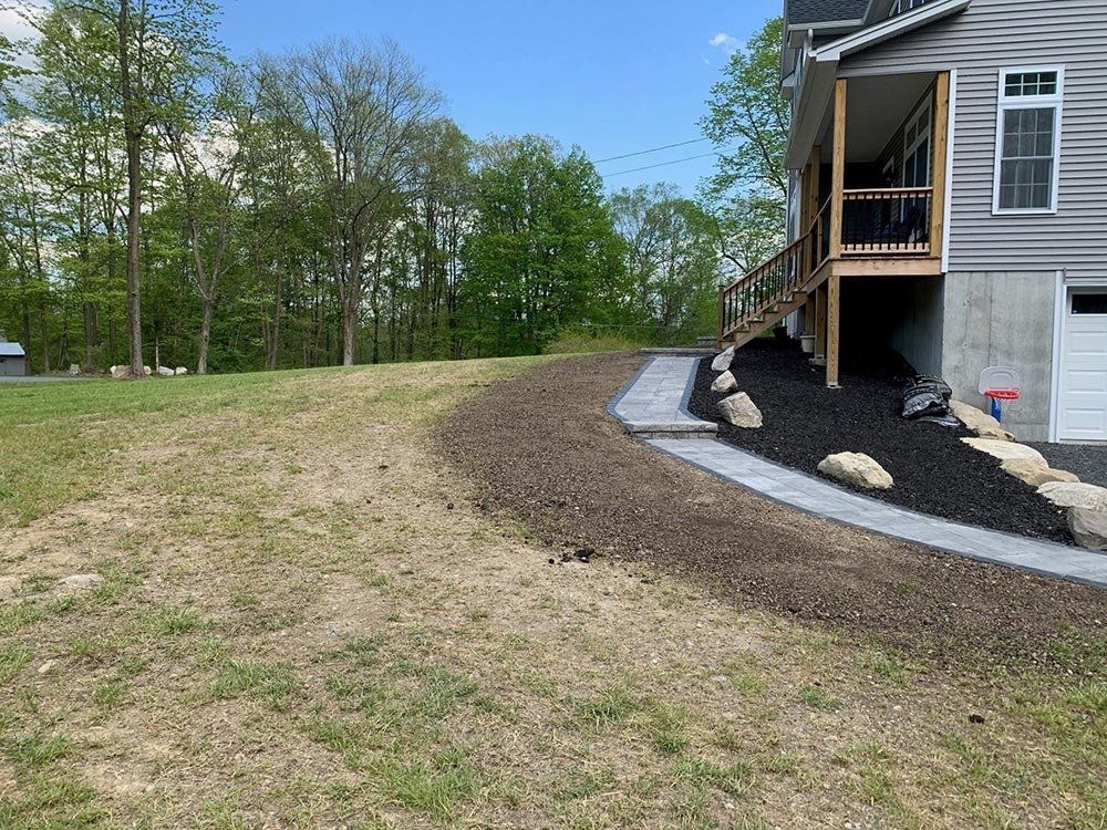 House with Patio and Walkway — Montgomery, NY — Creative Touch Landscaping & Supply