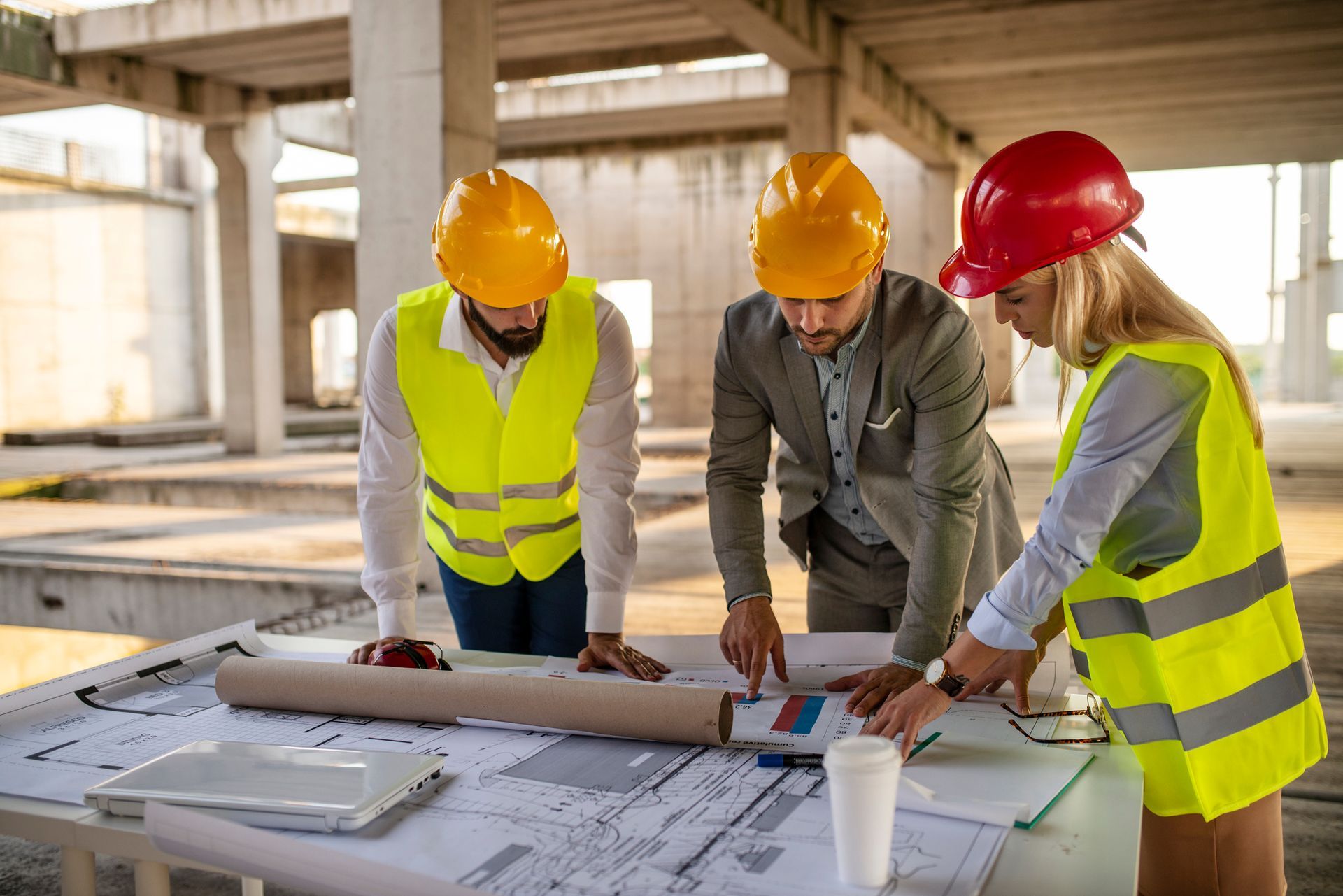 A group of engineers meeting on-site, representing a trusted civil engineering consultation company.