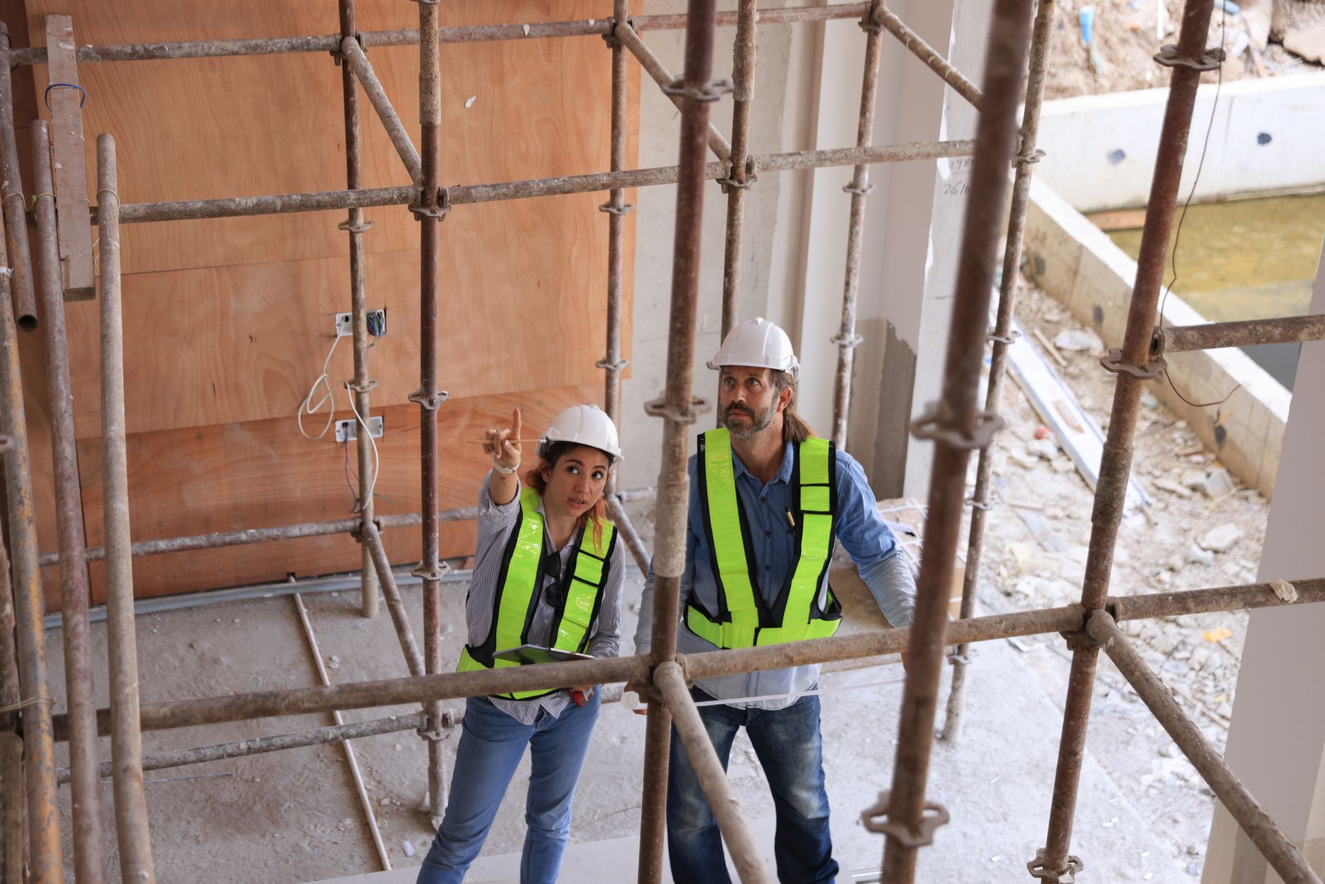 Two Engineers point at Building Offering Civil Engineering Services | Menomonie, WI 