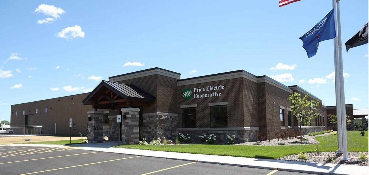 A large brick building with a flag in front of it
