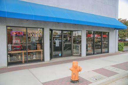 Storefront with a blue awning, glass doors and windows; a fire hydrant is in front. Storefront with a blue awning, glass doors and windows; a fire hydrant is in front.