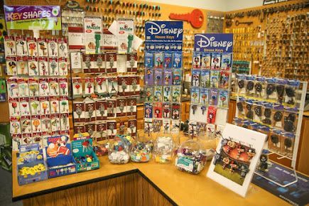 A key shop display features Disney keys, key shapes, and key accessories.