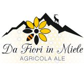 un logo per da fiori in miele agricola ale con un fiore e una montagna.