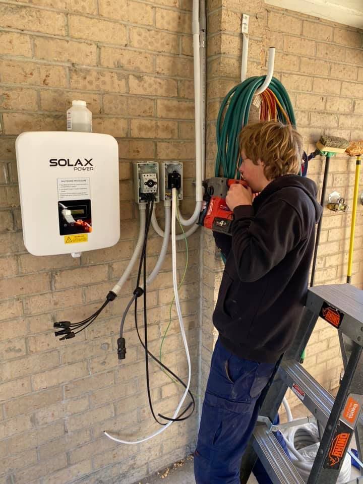 Man Setting up the Security Alarm System — Electrical Services in Ballarat