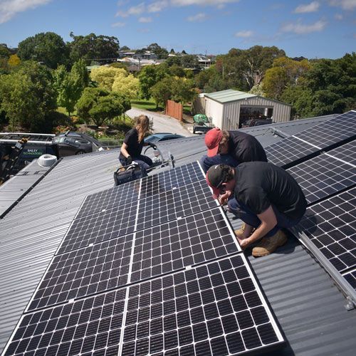 Three Workers Installing Solar Panels — Electrical Services in Lake Gardens VIC