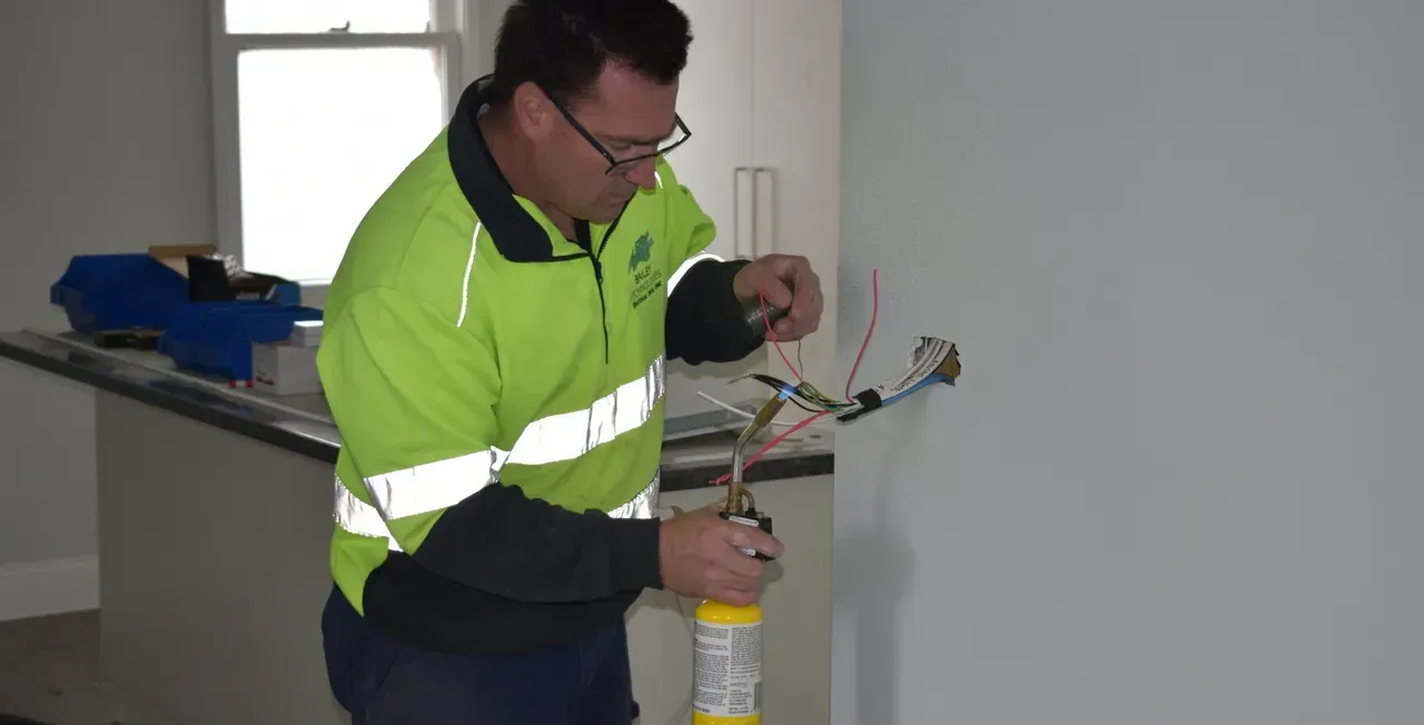 Man Working with Electrical Wires  — Electrical Services in Ballarat