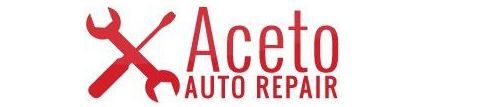A logo for x aceto auto repair with two wrenches