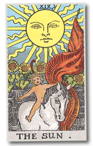 Tarot card “The Sun” with a radiant sun, child on a white horse, and sunflowers under a bright sky