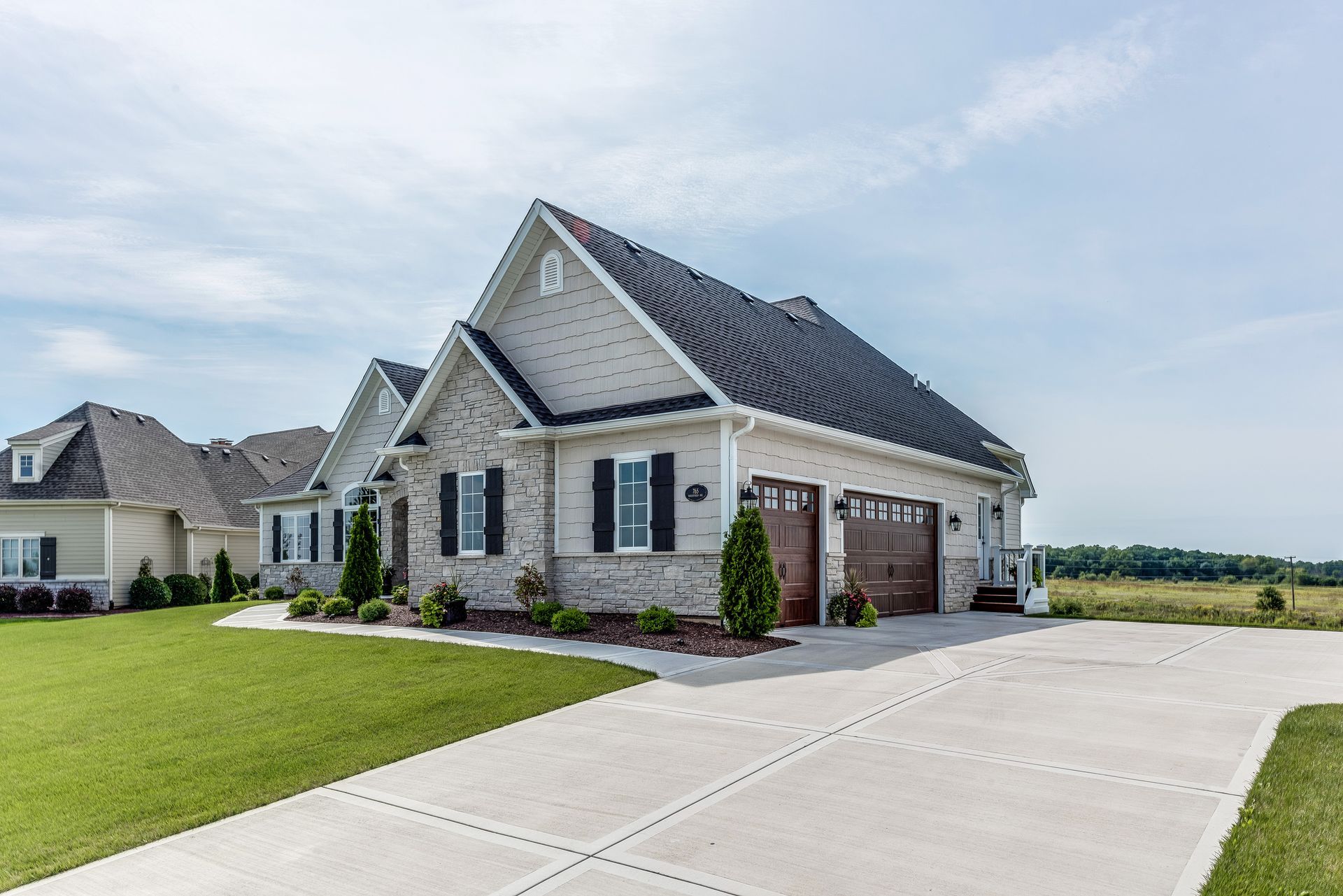 Two-Car Garage Attached to A Brick House with A Long Concrete Driveway — Tucker, GA — A-1 Driveway Replacement Company