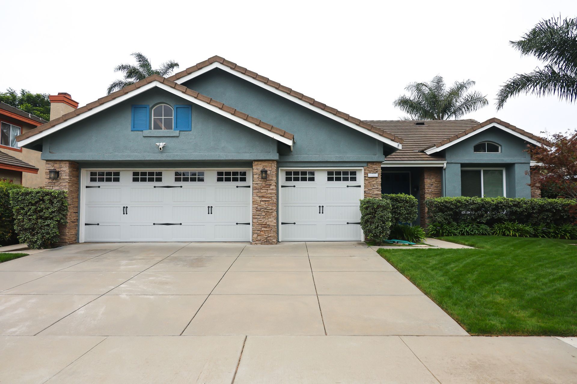 Light Blue House with Two-Car Garage — Tucker, GA — A-1 Driveway Replacement Company