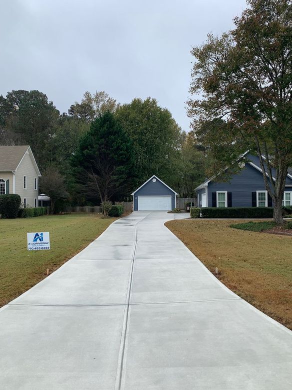 Long Concrete Driveway Leading to A Garage — Tucker, GA — A-1 Driveway Replacement Company