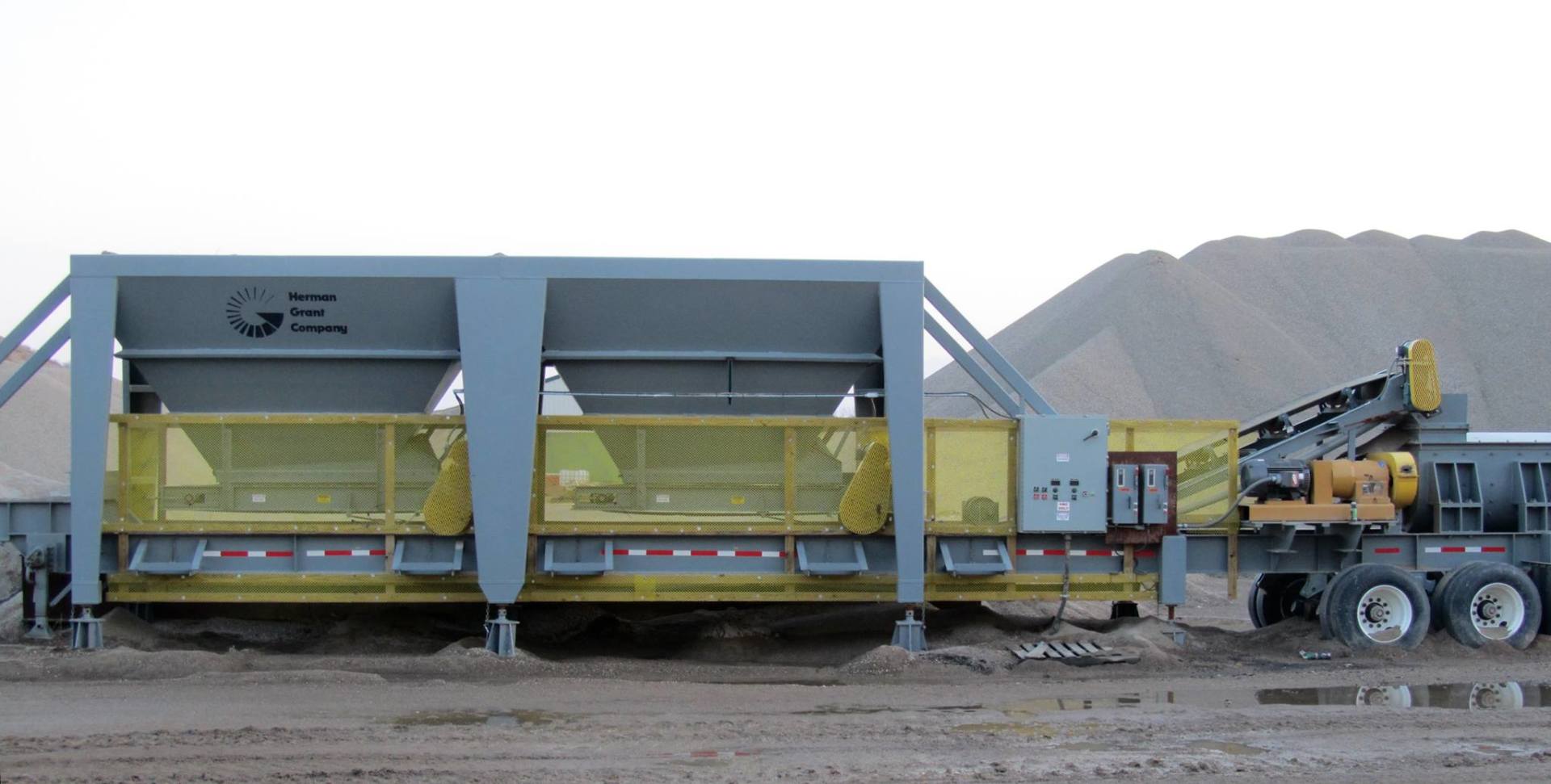 A large gray and yellow machine that says ge on it