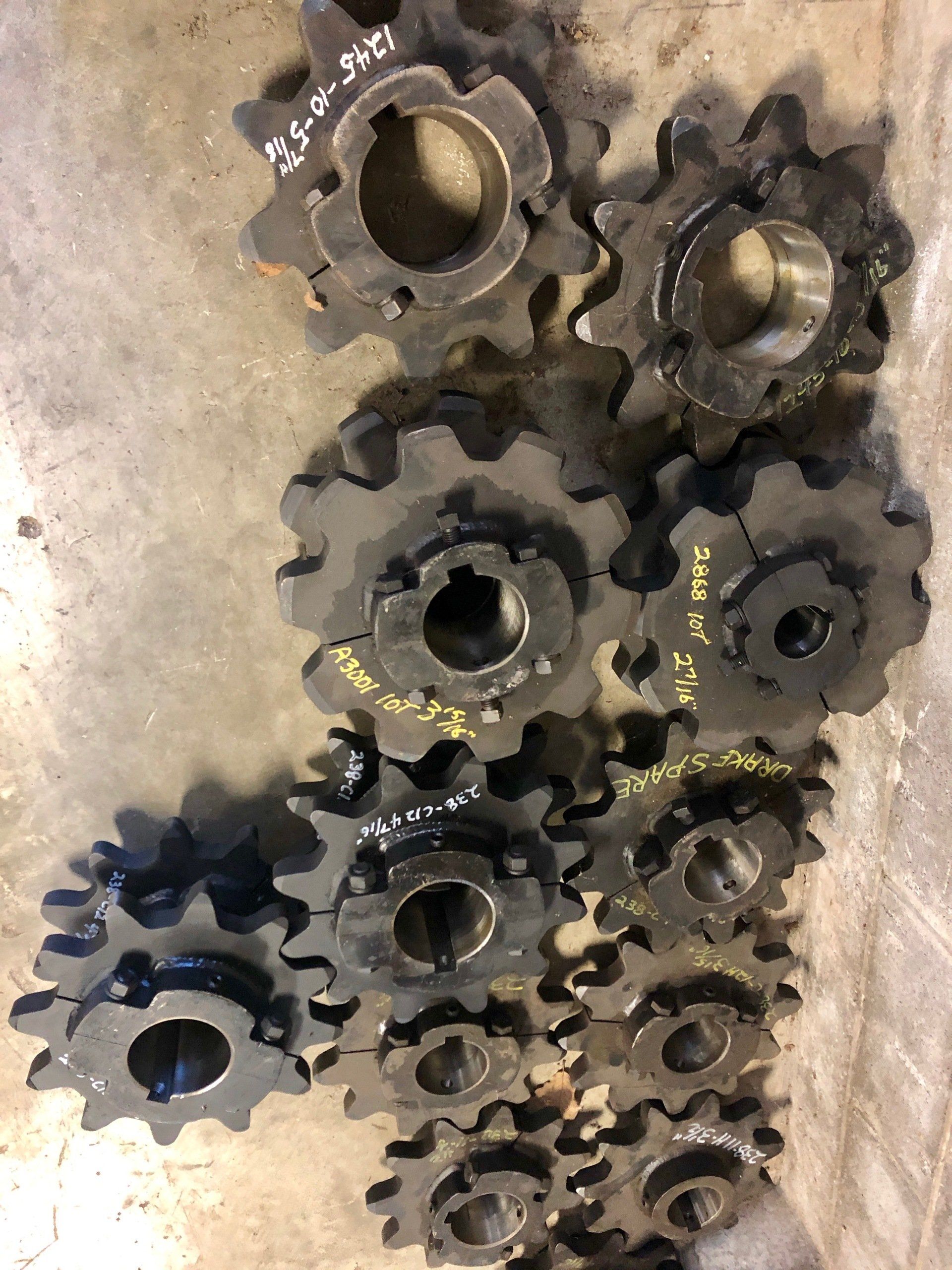 A bunch of gears are sitting on top of each other on a table.