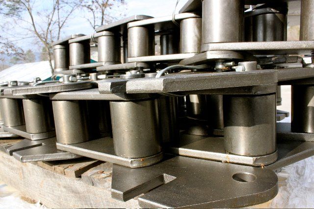 A bunch of metal chains are sitting on top of each other