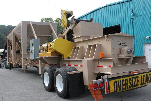 An oversize load is being transported on a trailer