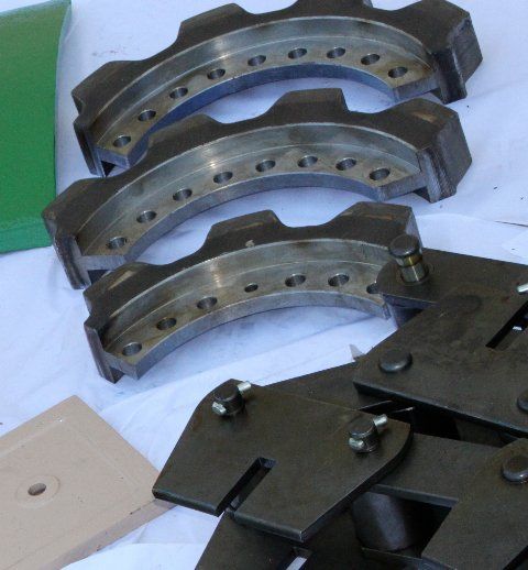 A bunch of metal pieces are laying on a table