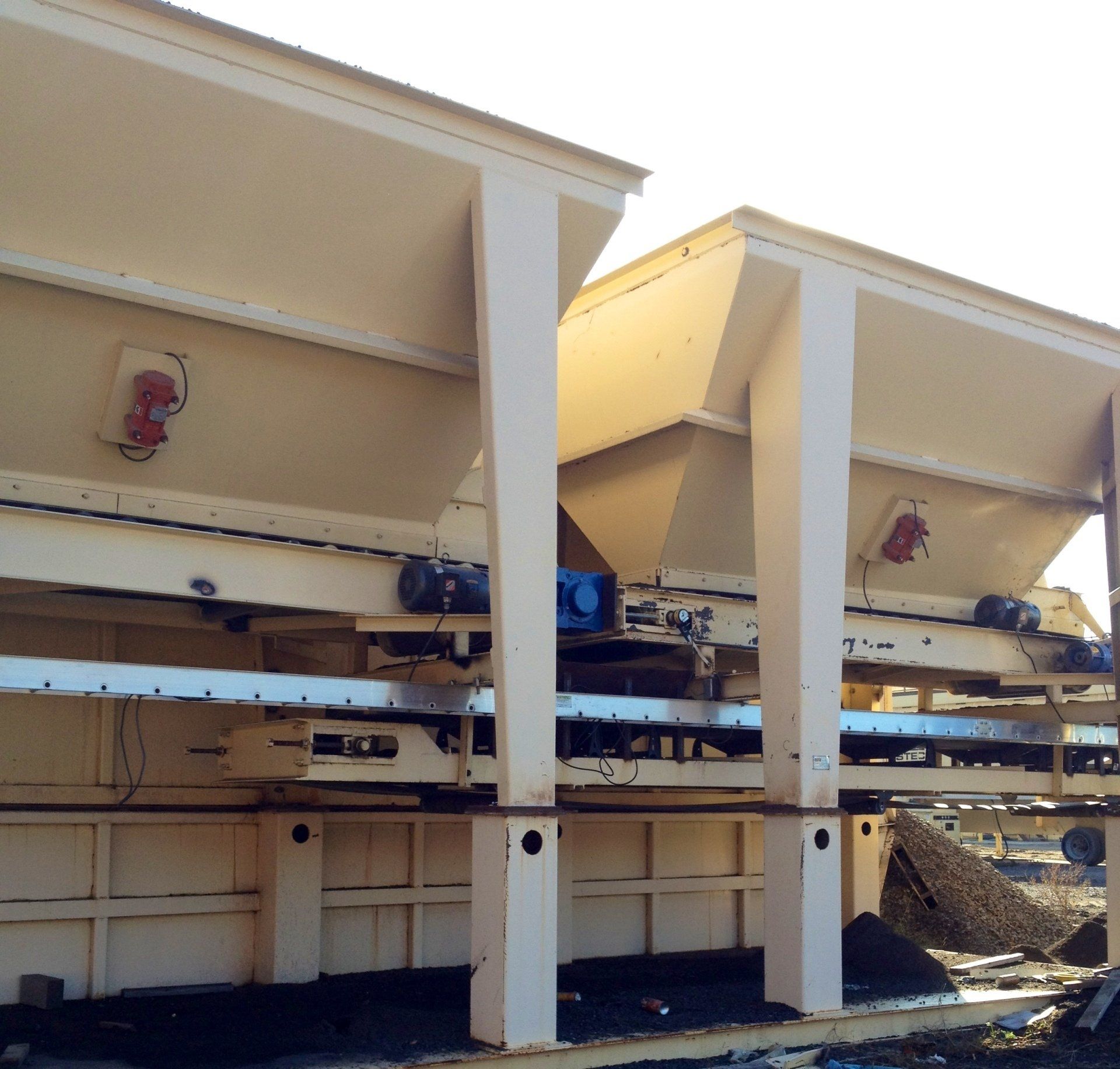 A row of buildings with a lot of machinery on them