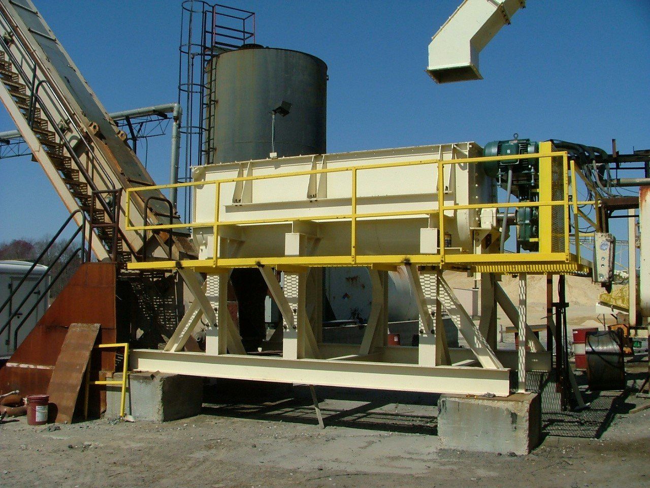 A large machine with a yellow railing and stairs